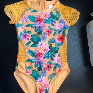 One piece swim suit with floral print.